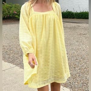 Yellow long sleeve dress.
